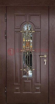 Темная железная дверь со стеклом и ковкой для частного дома ДСК-156 в Великом Новгороде