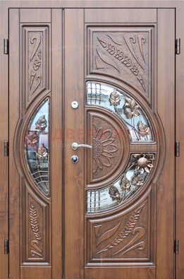 Уличная дверь в цвете Итальянский орех с виноритом и ковкой со стеклом ДВТ-147 в Оренбурге
